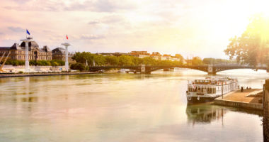 View of the Rhone river at sunset in summer with the bridge University in the background in Lyon France. Horizontal composition