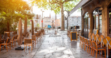 Street view with cafes near the river in the old town in Lyon city